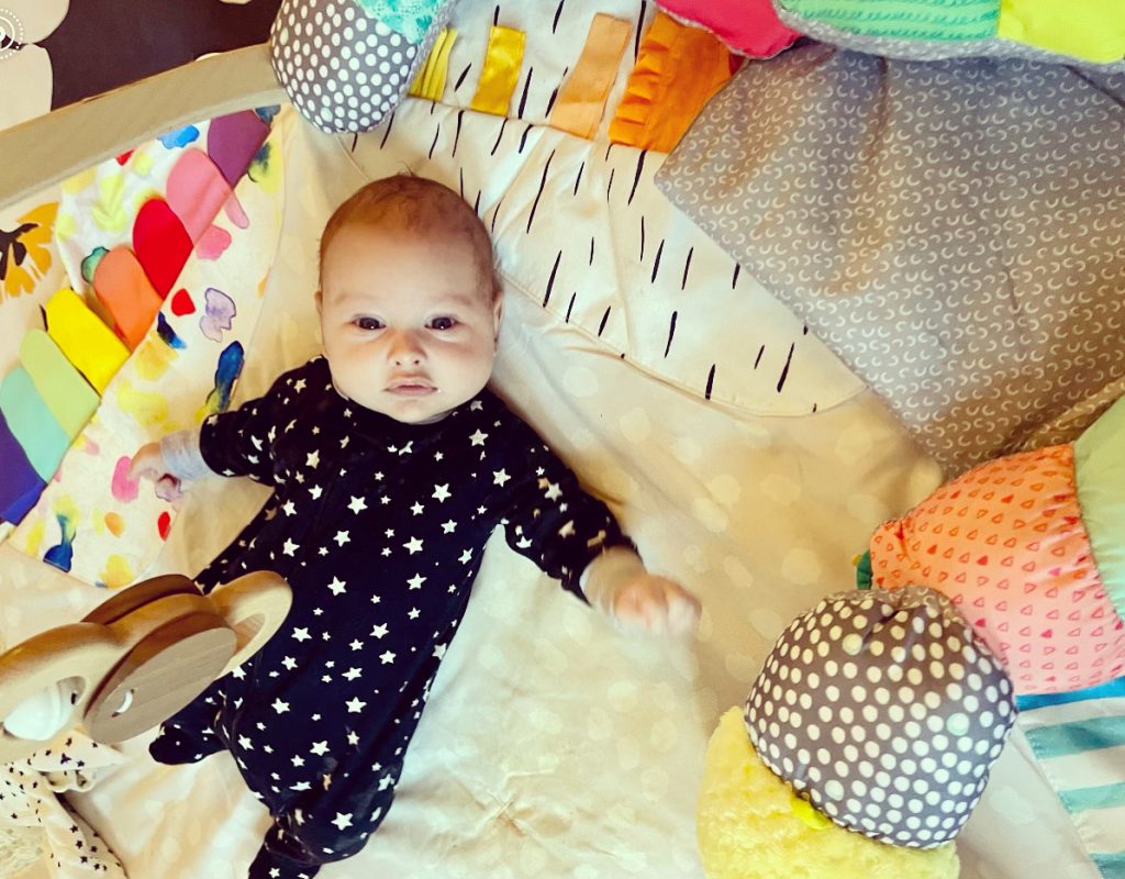 baby on lovevery play mat